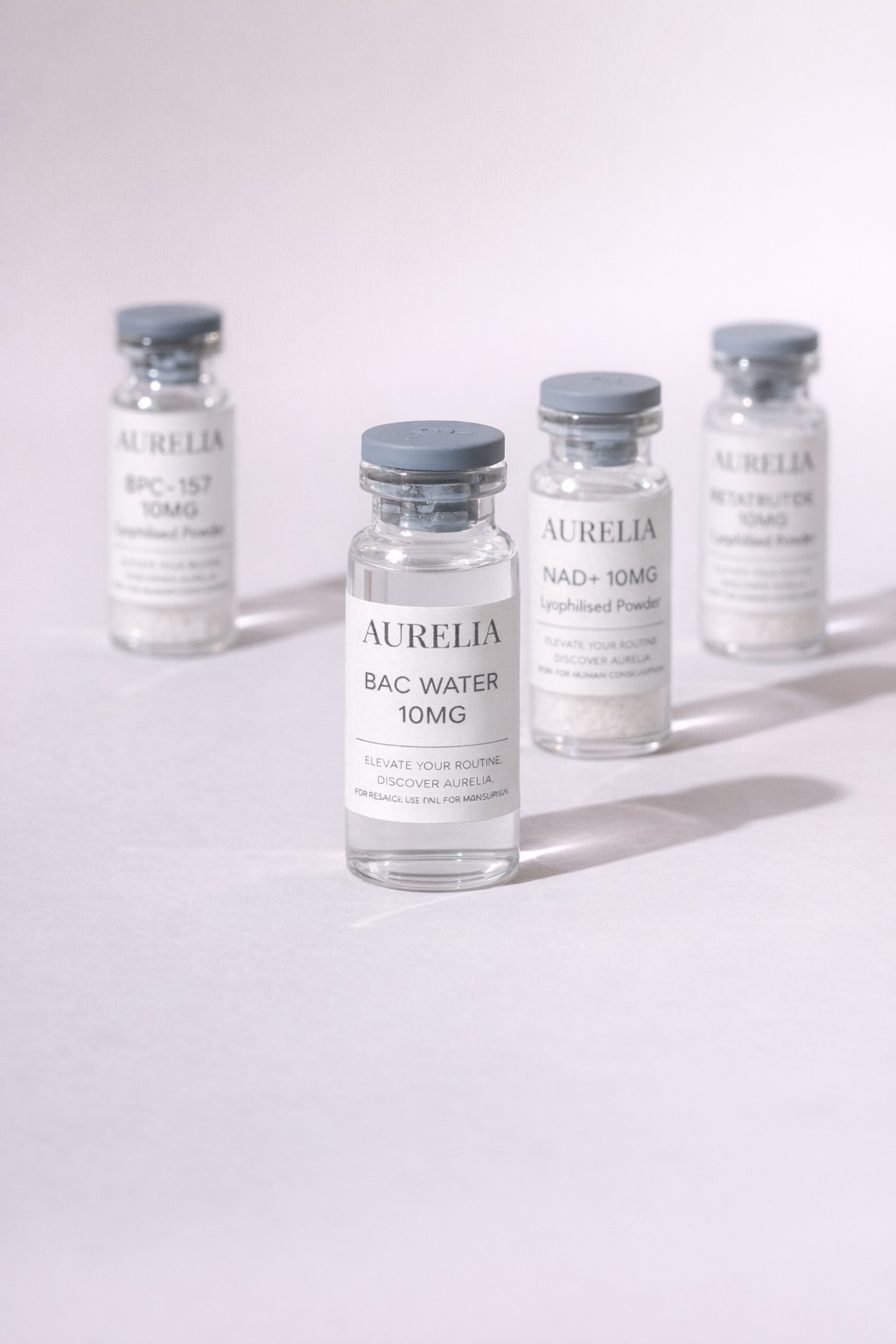 Aurelia vials arranged in soft studio light