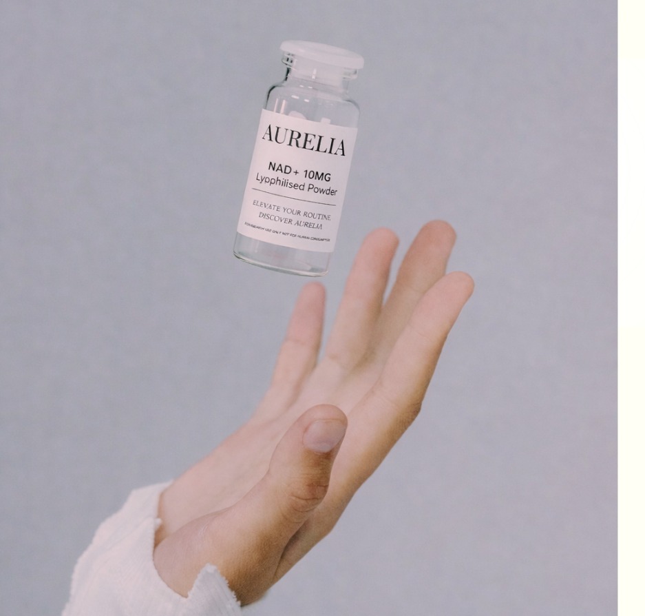 Aurelia vial held above an open hand